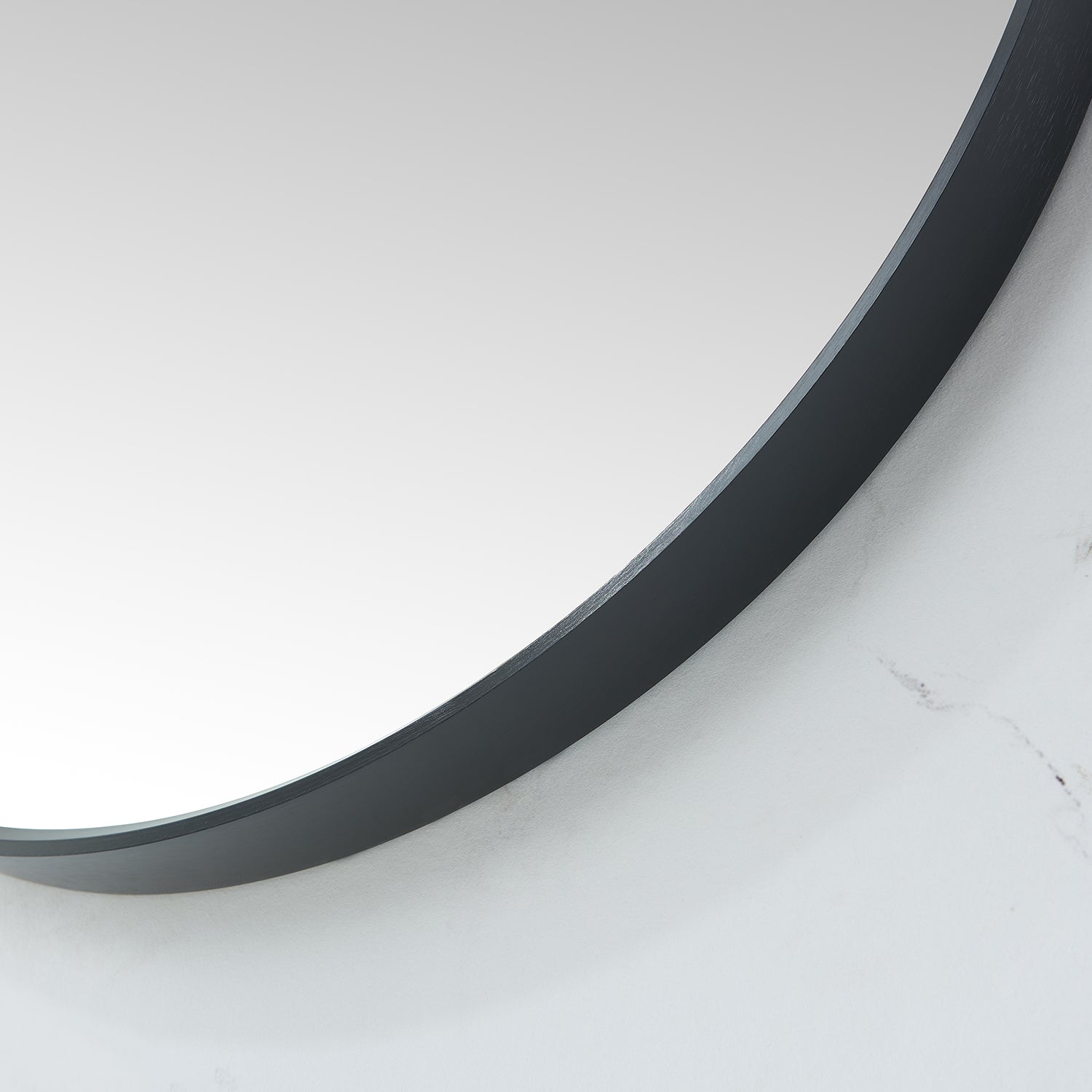 Cascante 35.4 in. W x 35.4 in. H Round Metal Wall Mirror in Brushed Black
